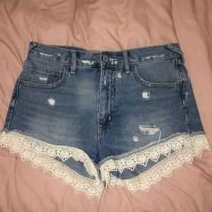 Free people denim shorts with crochet detail